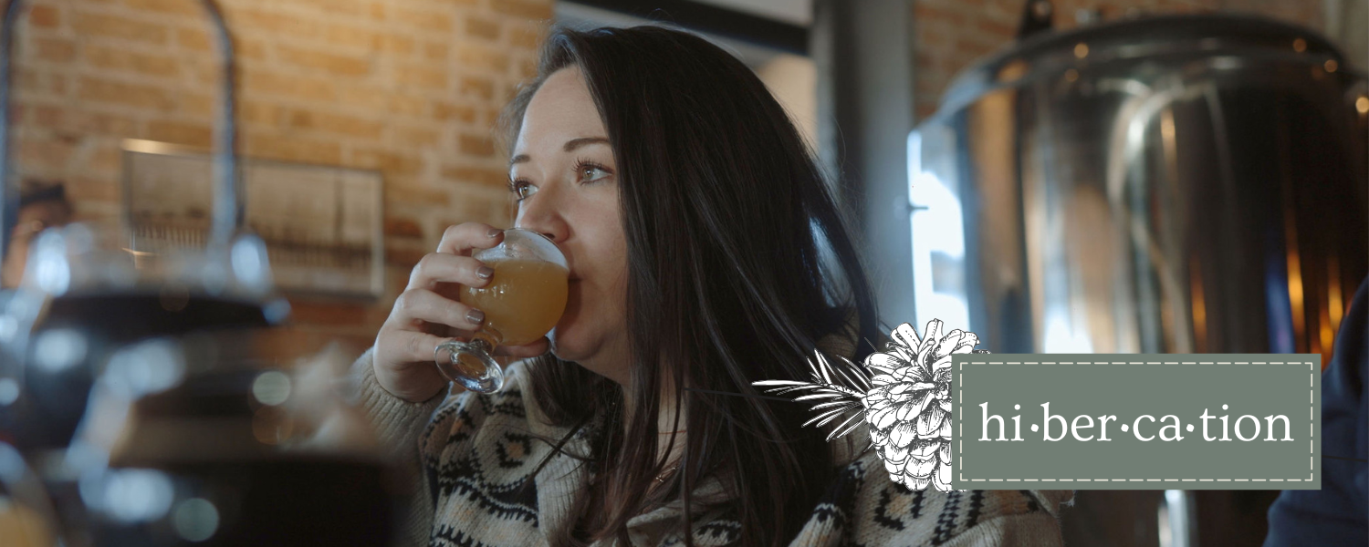 Women drinking a glass of  a specialty Hibercation brew