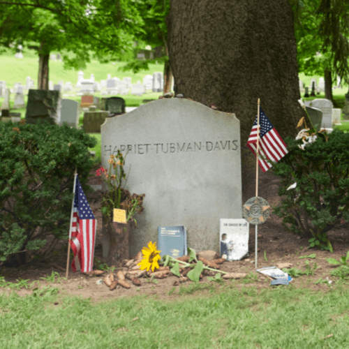 Photo of Harriet Tubman's headstone in the summer, located in Fort Hill Cemetery in Auburn NY.