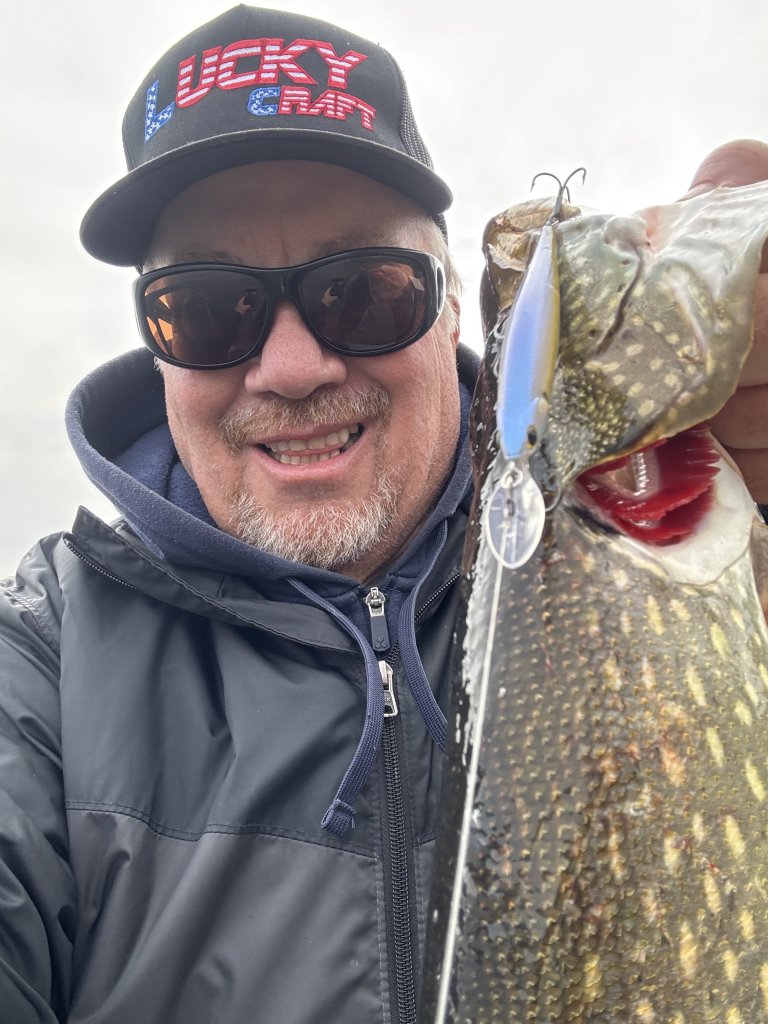 Ambassador George holding a pike 