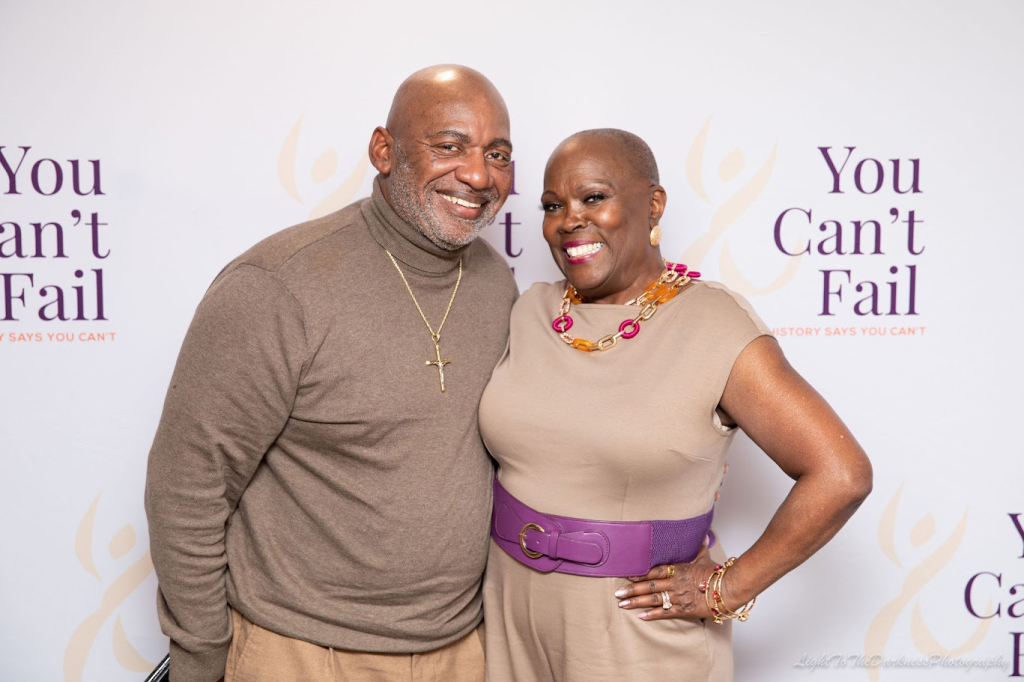 Photo of a couple dressed in beige tones. Gwen Webber-McLeod and Tracy McLeod